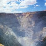 convergent  Open-pit mines such as this one are used when ore is near the