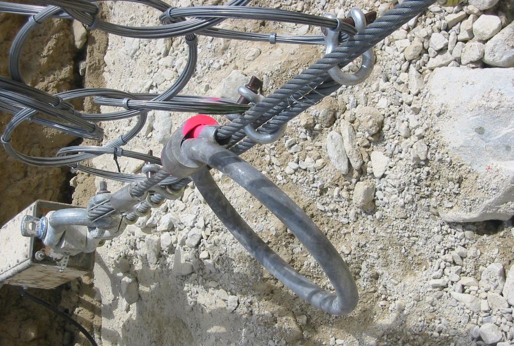 26 Monitoring, Simulation, Prevention and Remediation of Dense Debris Flows II Figure 3: A not deformed brake ring (left) compared with an elongated one (right) installed in support ropes: A rope