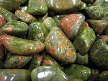 Rocks with minerals in them: epidote-green, feldspar-red, quartz-white. A quartz crystal is a mineral.