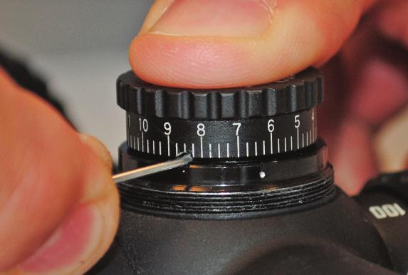 2) Put pen or other small object into the small hole located on the dial.