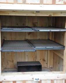The Smokehouse includes four slide-out grates, a thermometer that measures internal temperatures,