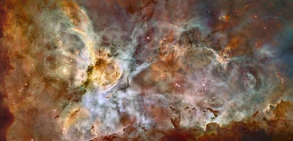 The Carina Nebula is a large bright nebula which surrounds several open clusters of stars. Eta Carinae, one of the most massive and luminous stars in the Galaxy, is one of them.