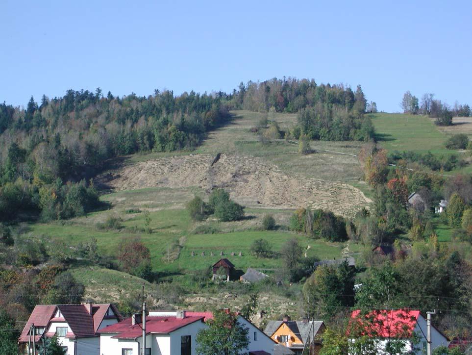 Photo 1. Landslide in Lachowice - autumn 2001 (courtesy of W. Rączkowski, PGI) The new landslide was delimited by an arcuate main scarp (roughly 1.