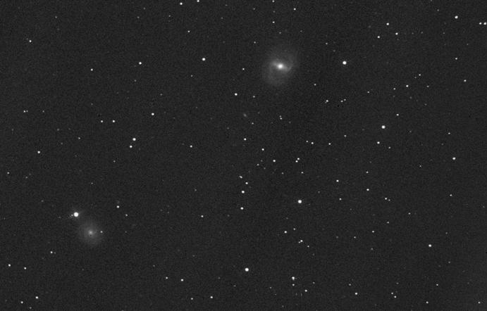 The Messier Objects 119 Fig. 2.91 Photo of M91 ( upper middle ) and NGC 4571 ( lower left ); 50 min exposure on hypered Kodak Tech Pan film, 8 f/6 telescope. North is up and east is to the left.