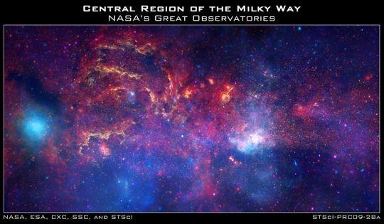 The center of the galaxy is located within the bright white region to the right of and just below the middle of the image.