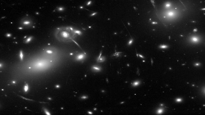 Gravitational lensing by a cluster of galaxies: