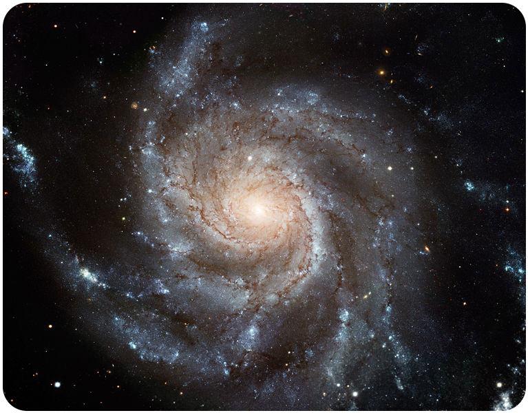 4 The Pinwheel Galaxy is a spiral galaxy displaying prominent arms. Elliptical Galaxies Figure 1.5 shows a typical elliptical galaxy. Elliptical galaxies are oval in shape.