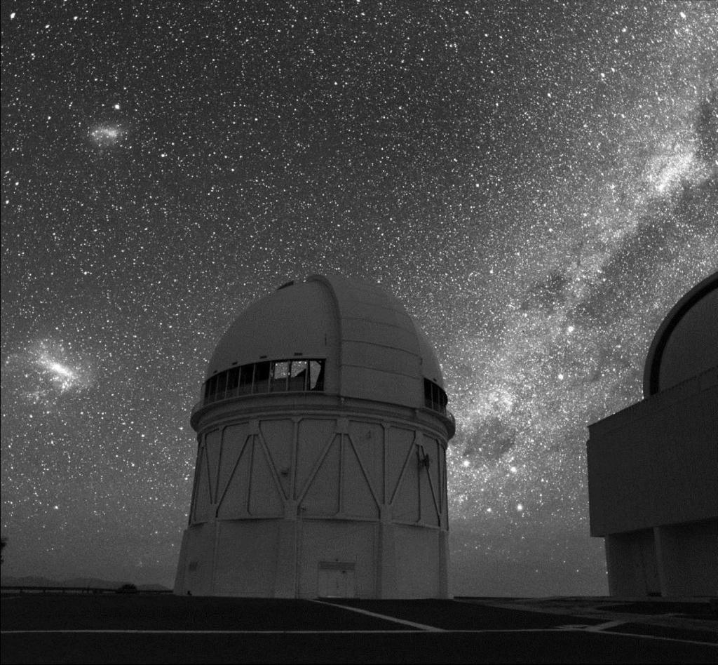 Orbiting beyond the visible-light edge of our galaxy (to the right in the image below) are two dwarf galaxies called the Large and Small Magellanic Clouds (to the left in the image below): (Photo