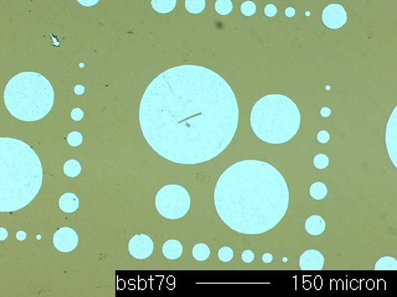 were etched using a 10% buffered HF solution in order to expose the SrRuO 3 bottom electrode. Fig. 4.20. Optical microscope image of top electrodes used in this thesis. 4.2.1 Dielectric Properties vs.