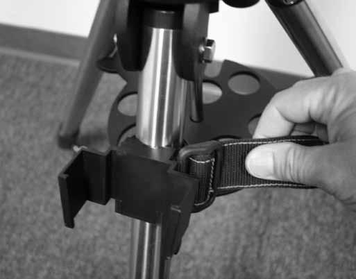 If you attach it above the accessory tray it will not be able to slide down the leg. See Figure 5.
