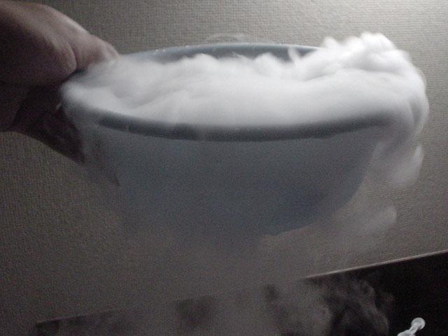 When dry ice heats up it sublimates into carbon dioxide gas, which is a normal component of air. Dry ice is -78.5 C.