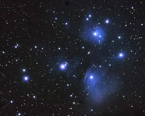 The Pleiades, or seven sisters, (M 45) is an open star cluster containing relatively young hot B-type stars located in the constellation of Taurus.
