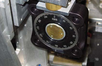 Incident angle rotator Azimuthal angle rotator Sample mounting plate (An open aperture at center) Figure 4-2.