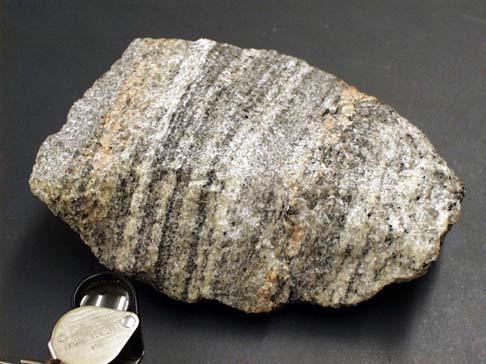 7 Non- 8 Gneiss: a metamorphic rock displaying gneissose structure. Gneisses are typically layered (also called banded), generally with alternating felsic and darker mineral layers.