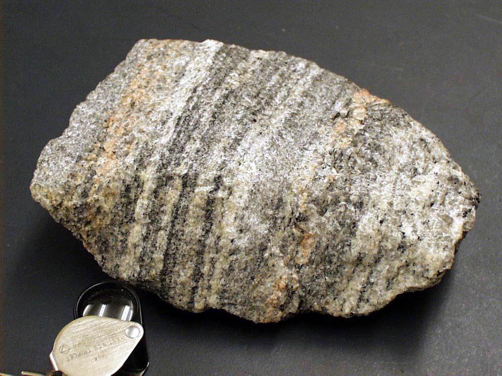 Foliated Metamorphic Rocks Gneiss: a metamorphic rock displaying gneissose structure. Gneisses are typically layered (also called banded), generally with alternating felsic and darker mineral layers.