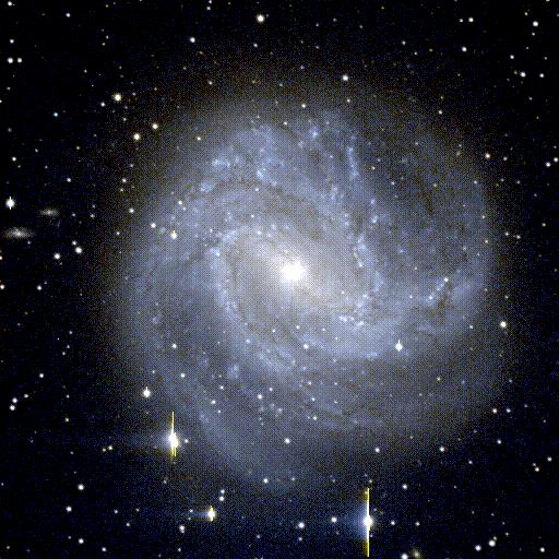 (a) (b) Figure 2.7: (a) Barred spirals M83, an SBc galaxy (W.