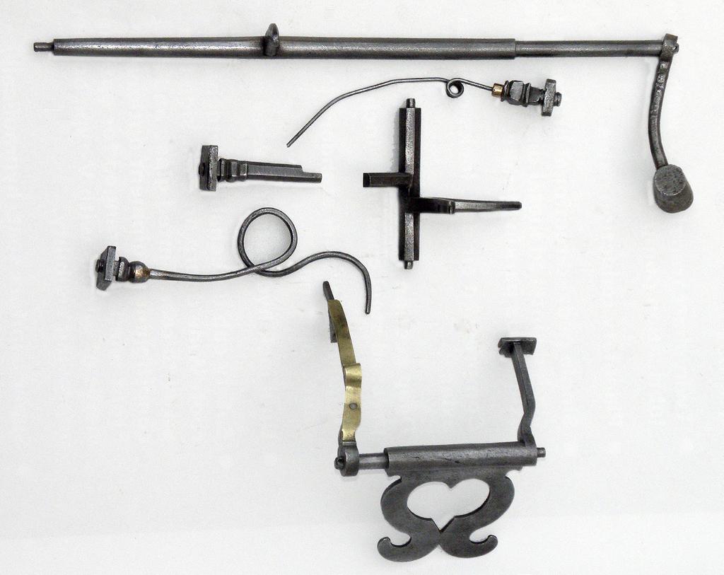 JUNE 2013 The components of the strike-work, all of iron apart from the brass return spring of the nag s head. The seemingly simple locking detent also acts as an overlift lever and countwheel detent.