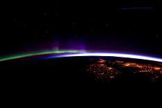 This photo (left) is of the Aurora Borealis, taken about 390 kilometers (240 miles) over the northern Atlantic. The lights are from the cities in Ireland and the United Kingdom.