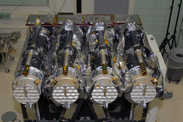 Figure 1: The AIA instrument aboard the SDO spacecraft each telescope. Six of these channels observe lines of ionized iron, and one observes ionized Helium.
