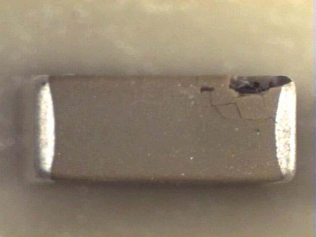 post-test cross section showing internal cracking The HVArc Guard TM 1812 case size X7R 100nF 500VDC rated MLCCs
