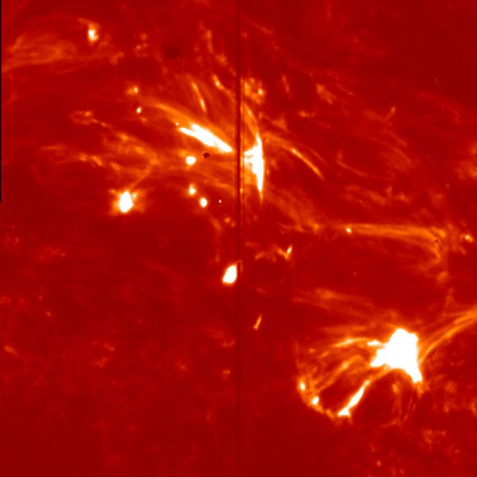 994; Yokoyama & Shibata 995) are believed to be strongly associated with the null-point reconnection in the corona.