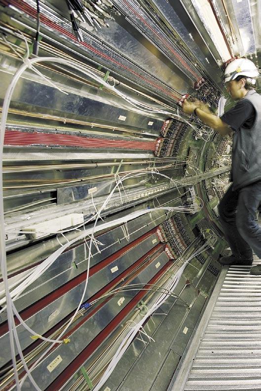 EXTRACTING PHYSICS FROM THE LHC By James Gillies Experiments at the Large Hadron Collider