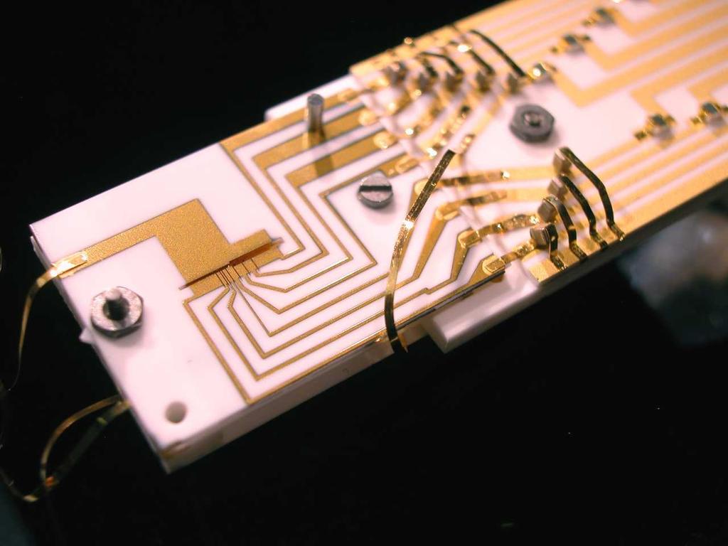 60 RF Electrode 1.5 cm Filter Boards DC Electrodes Trap Waffers Figure 4.1: Multizone wafer linear RF Paul trap, the quantum logic trap.