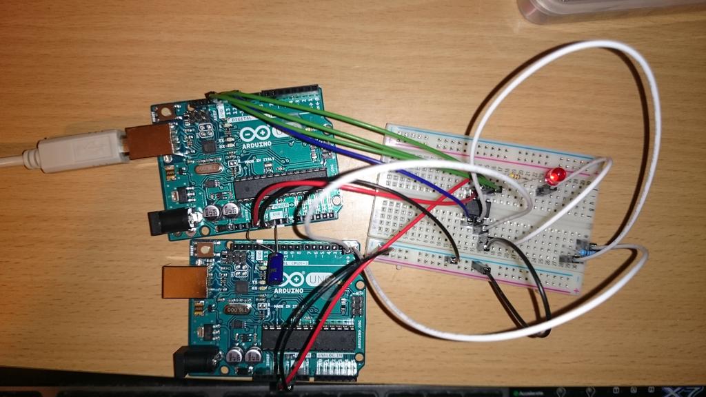 2. Hardware directly commanded to do so. The setup used to flash and extract data from the ATtiny using an Arduino Uno is displayed in Figure 2.