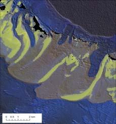 uniform in their development and have their shallowest portions as sinuous, linear features Elsewhere, the islands and channels are more regular and the active shoals between are organized into