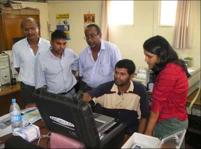 Fig. 3.3 Staff from the teams of Mauritius Meteorological Services working with the MODEM system during the second half of the intercomparison.
