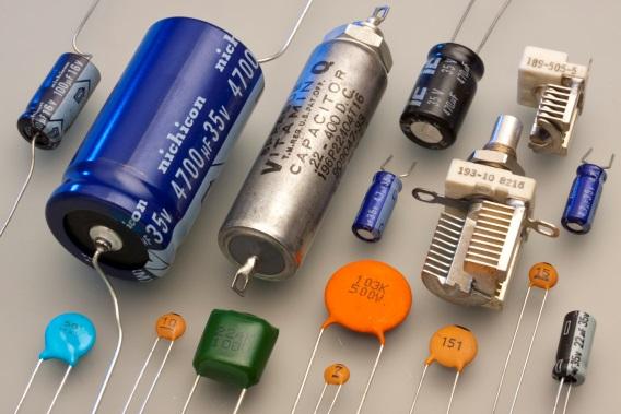 Capacitance Capacitors are made of two parallel plates, separated by a dielectric material. These may be foil plates and rolled in a tubular shape or simply bonded as flat metal plates.