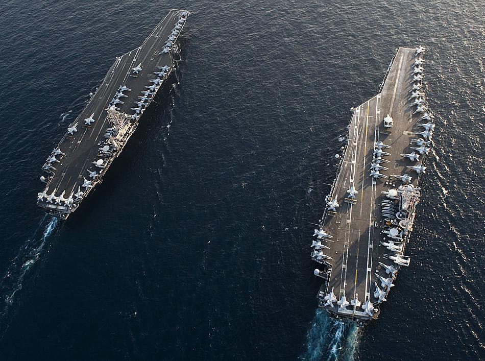Gravitational force between two Nimitz-class aircraft carriers Find the gravitational force between the two aircraft carriers pictured here.