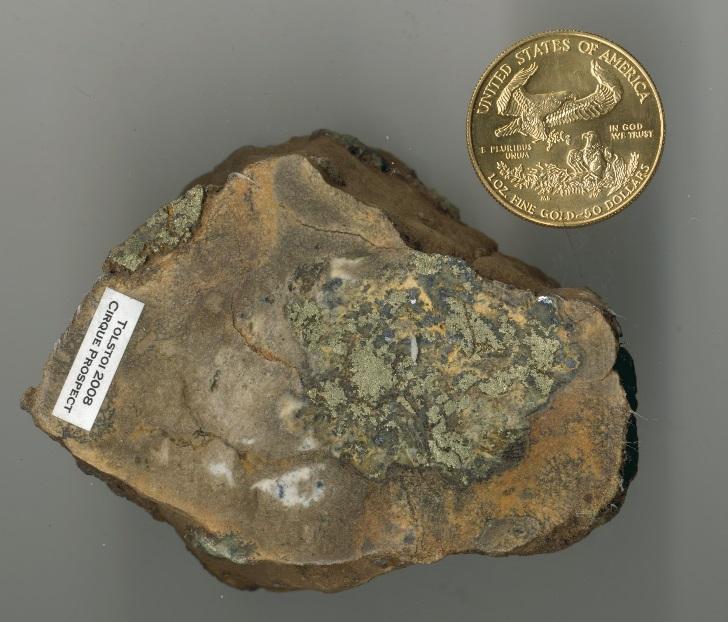 Left: clast of chalcopyrite and galena encased in brown carbonate from Cirque-Main deposit @ #203811,