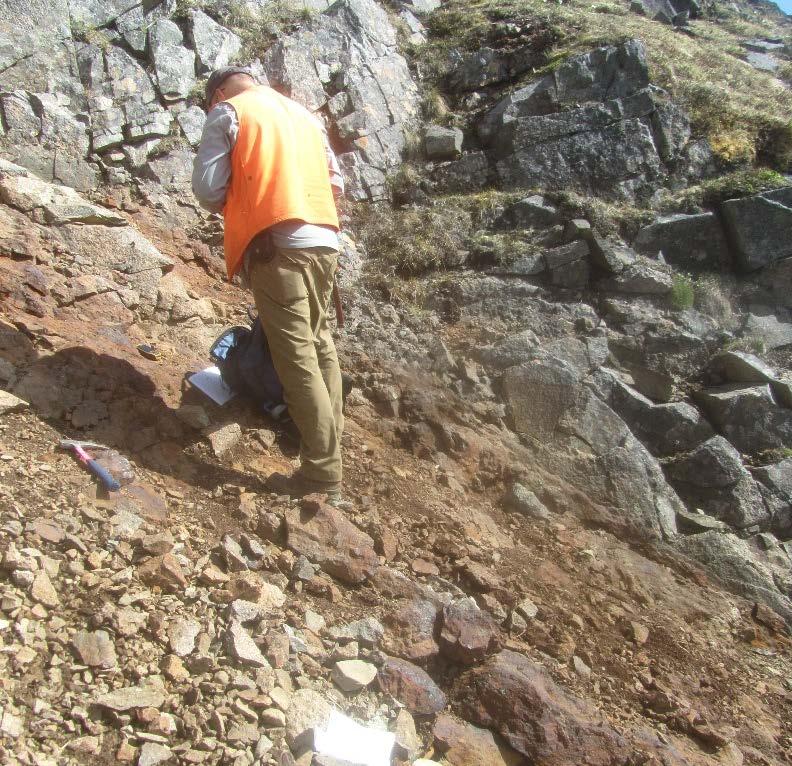 In-place exposure of Cirque-Main mineralization showing semi-massive chalcopyrite near the footwall zone. A 3.