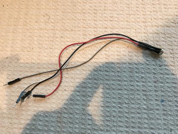 Idea is to extend the pins by soldering jumper wires to it (one side of the jumper wire stripped for soldering to the pins) and then wrapping everything up in heat shrink tubes