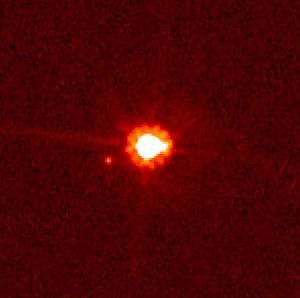 Eris, the largest known scattered-disc object (center), and its moon Dysnomia (left of object) The scattered disc is a distant region of the Solar System that is sparsely populated by icy minor