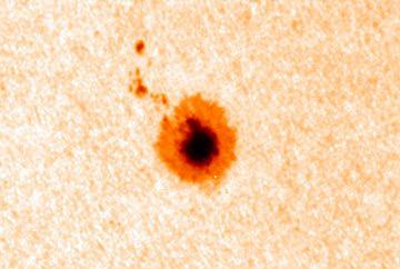 magnetic field, which we know to be strong in the sunspot at the surface.