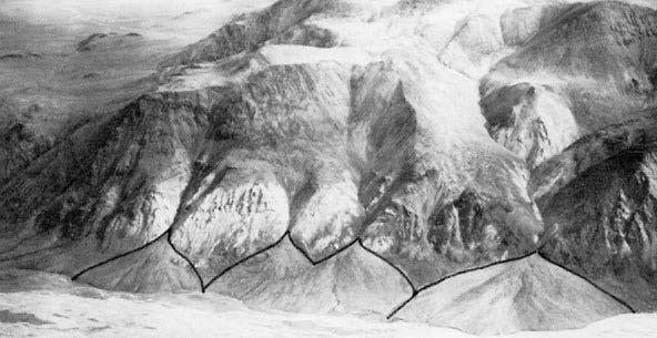 Figure 2.9 Characteristically shaped alluvial fans alongside a river valley in Alaska.