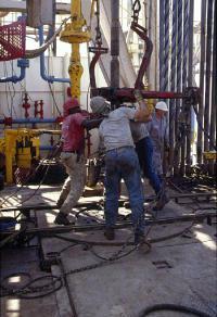 The crew sets up the rig and starts the drilling operations.