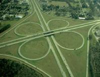 21 / 36 APPLICATIONS Cars traveling along a clover-leaf interchange experience an acceleration due to a change in velocity as well as due to a change in direction of the velocity.