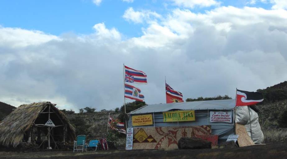 Land Rights: The upside-down Hawaiian Flag symbolizes the