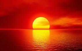 The Sun looks red at Sunrise/Sunset Sun atmosphere Earth At sunrise and sunset, Sun is close to the horizon. Sunlight has to travel a longer distance in the atmosphere to reach us.