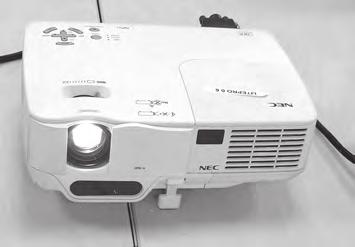 8 The photograph shows a projector with an automatic focusing system that detects the distance to the screen so it can adjust the position of the lens to produce a clear image.