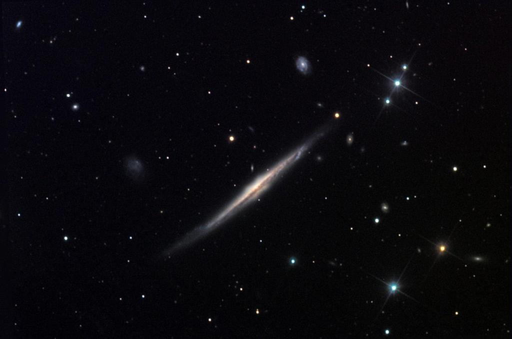 NGC 5529 Nearly edge-on, this galaxy will challenge small scopes.