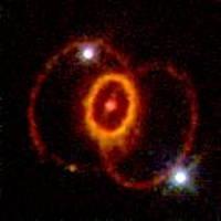 Supernova 1987A: A triple-ring nebula powered by core collapse supernova explosion.