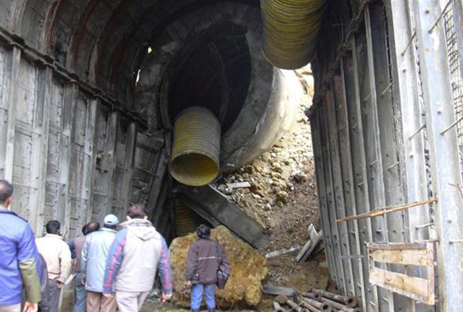 Tunneling of 237m in heading and 228m benching was completed till Feb 2005 through crushed dolomite charged with water except for small stretch of tunnel excavation through Clay Band.