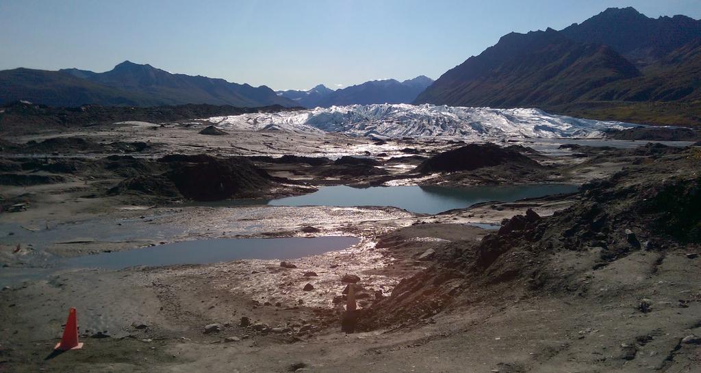 Figure 2: Standing on one of the terminal moraines of the Matanuska you can see the current location of the ice face and the debris field left behind.