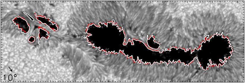 Only contours encircling regions larger than 3 Mm 2 are shown. Sunspots marked (L) clearly show a systematic displacement of the white and red contours that is due to line-of-sight effects.