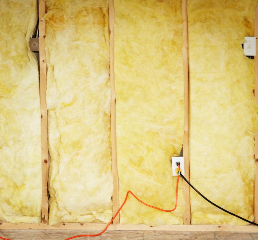 Section Insulating Buildings Building insulation is usually made of some fluffy material, such as fiberglass, that contains pockets of trapped air.