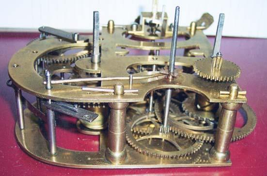 Top rear view of movement of Figure 1G, showing the ordinary fly and its #4 strike arbor, with a stop pin coming up from the upper strike control arbor.